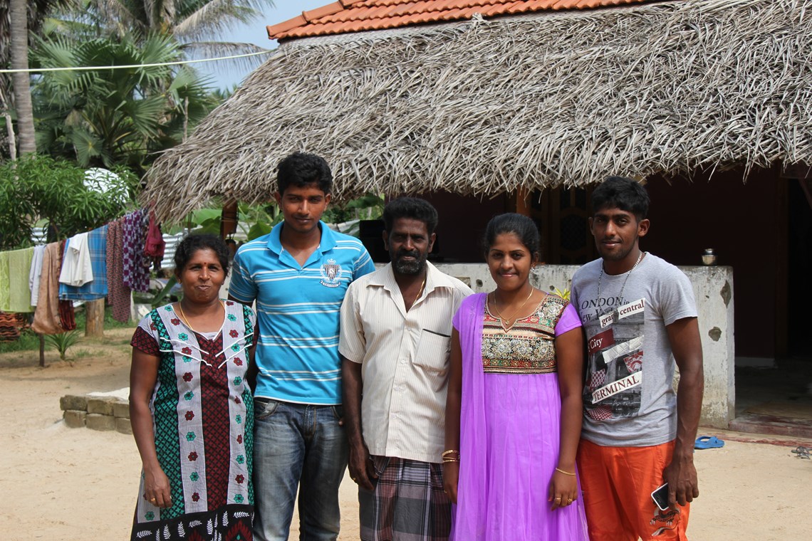 The Geevarasa family in front of their home in Sri Lanka, HALO Trust