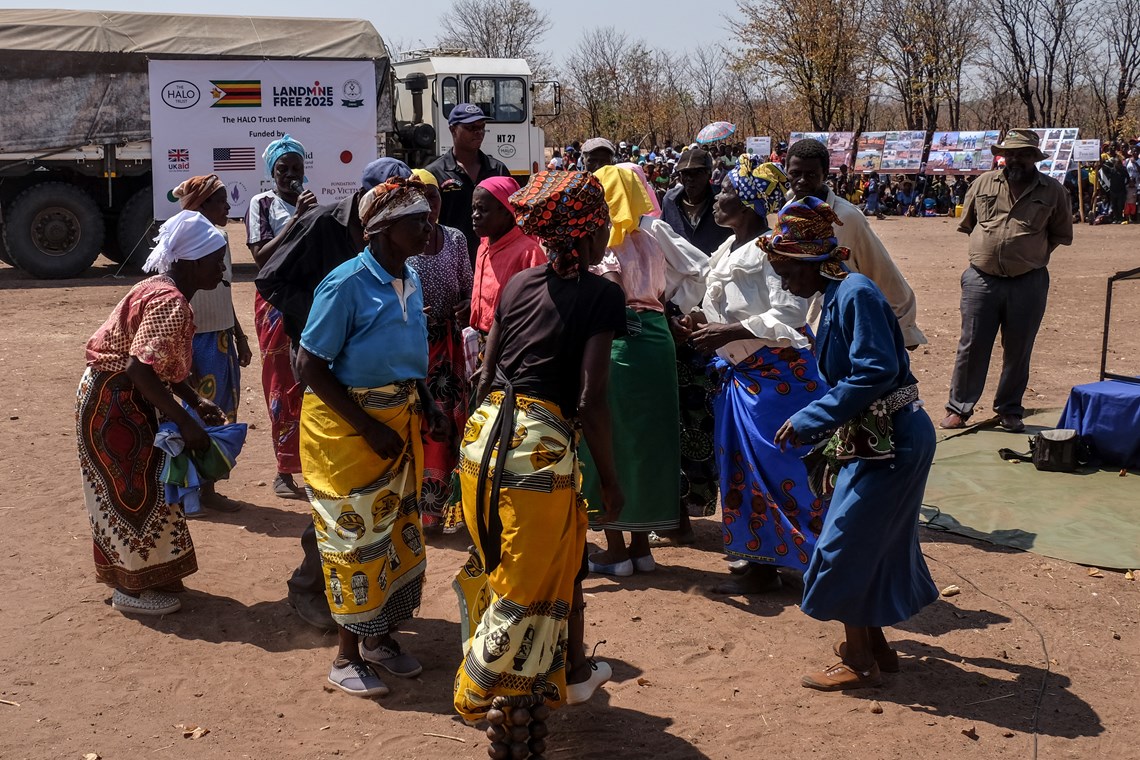 Local women perform a traditional dance at the handover ceremony.