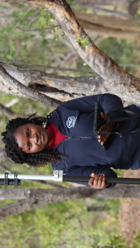 Delight Manyange, GIS Specialist, uses specialist technology to detect landmines