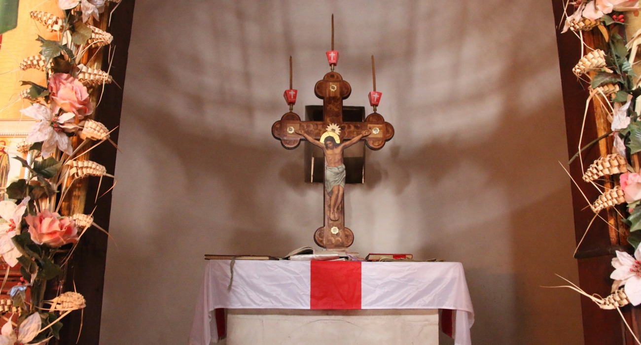 The altar at the Baptism Site, depicting an image of Jesus on the cross