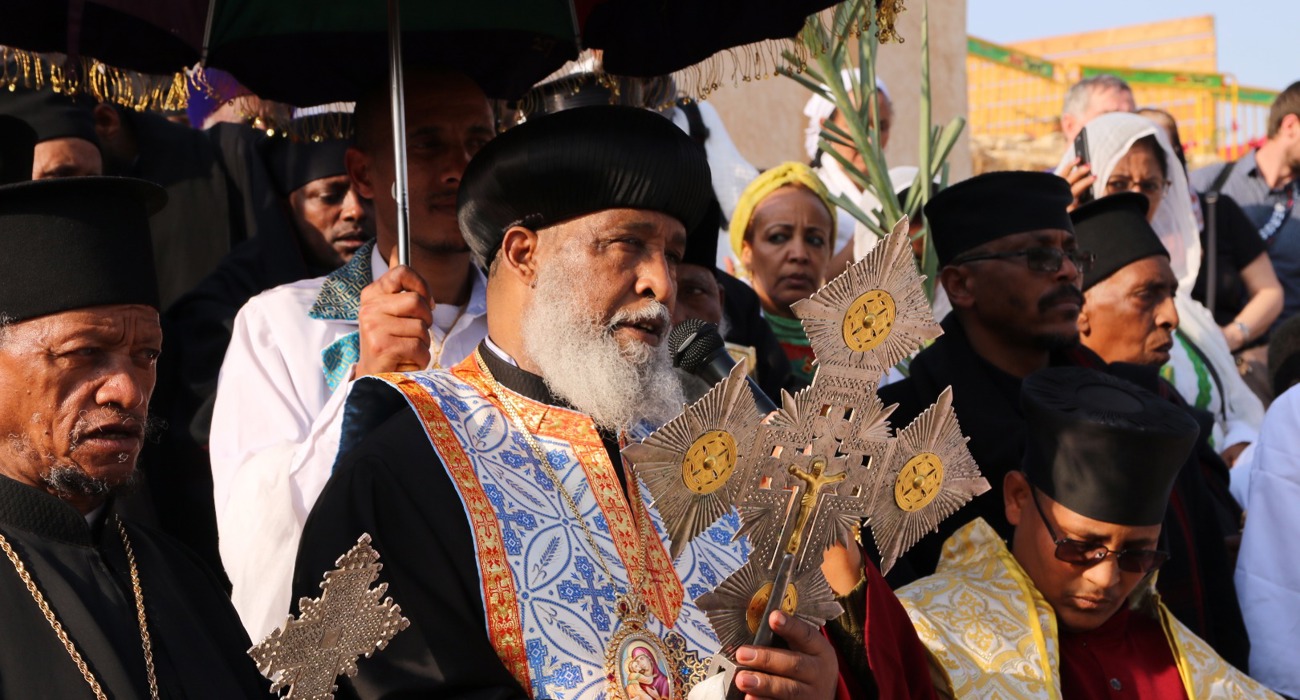 Clergy lead the Epiphany service, dressed in traditional robes