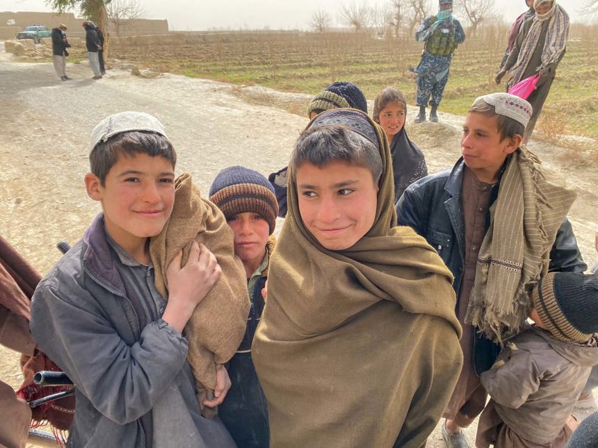 Kids stand outside Kandahar primary school