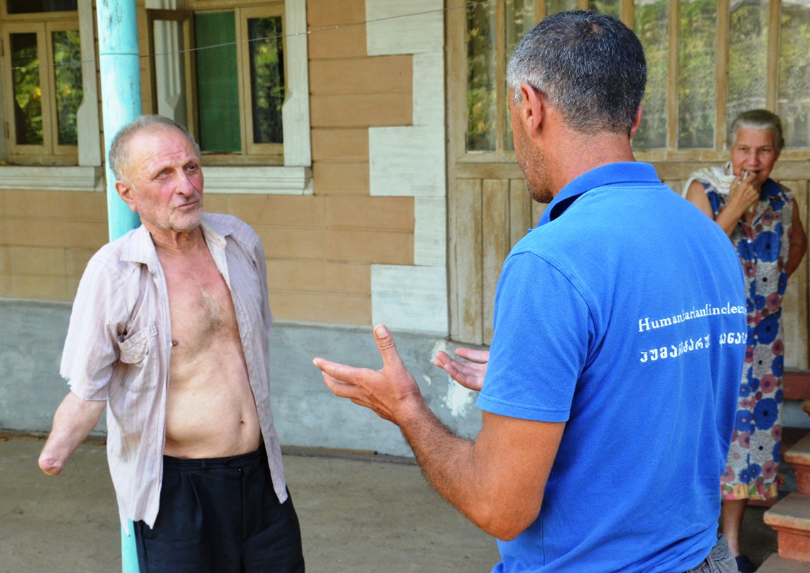 HALO operations officer interviews a landmine victim, Guram Eliava who lost his right hand and right eye.