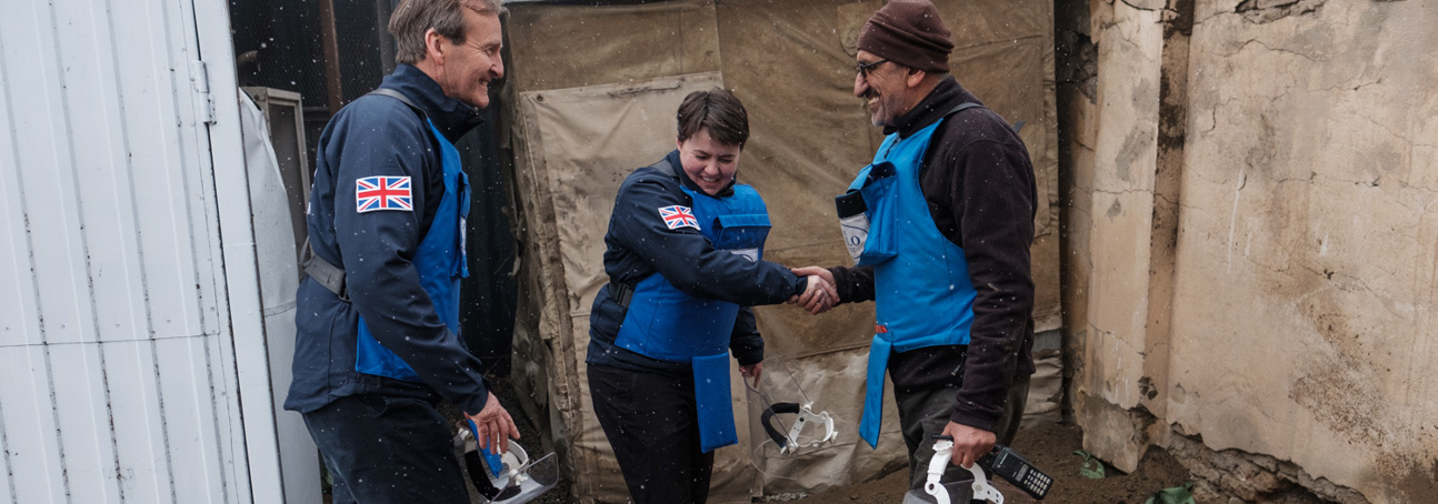 Two British HALO staff including Ruth Davidson shakes hands with Afghanistan HALO staff member