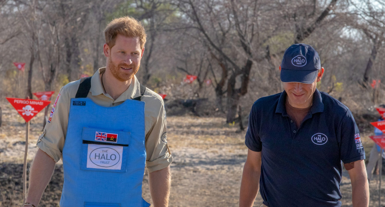 Prince Harry and HALO Trust CEO, James Cowan wear PPE and walk through a cleared minefield