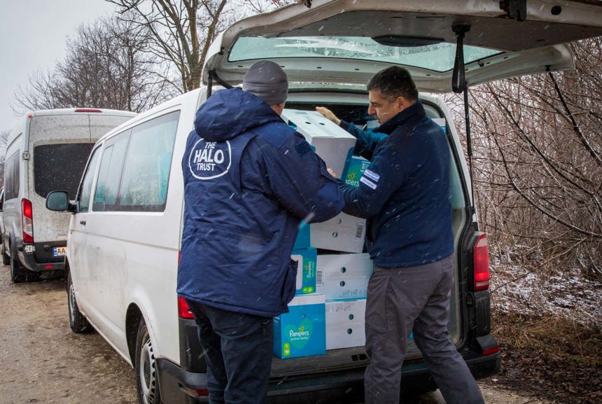 HALO staff load boxes into a van in Ukraine