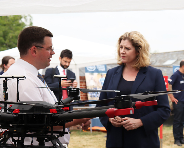 A Cobham engineer demonstrates a new piece of equipment for Penny Mordaunt during a visit
