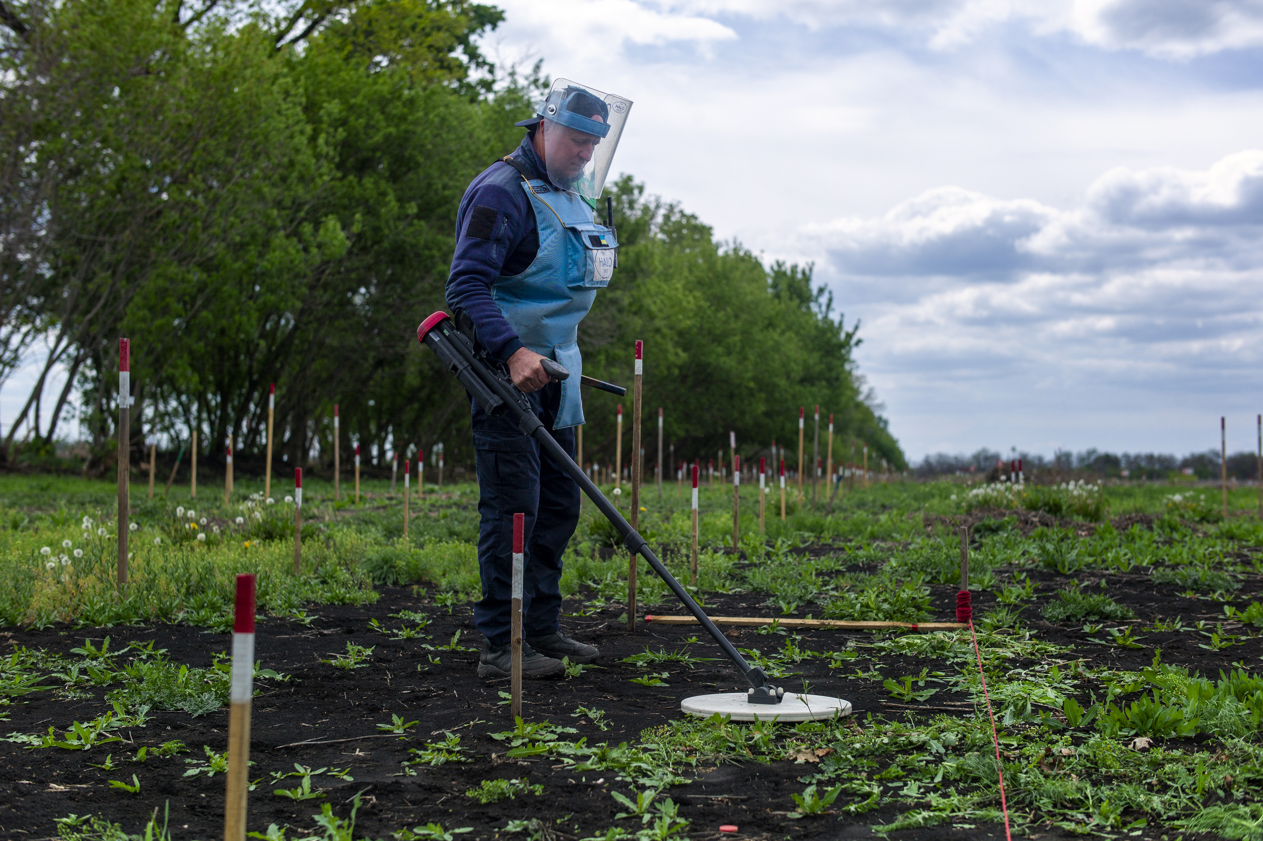 8. Deminer with detector at work
