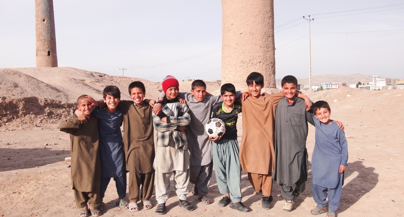 A group of children stand in front of the Minarets in Herat, following clearance of explosives by The HALO Trust and 