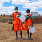 jongwe-village-two-girls-collect-tippy-taps-zimbabwe-halo-trust.jpg