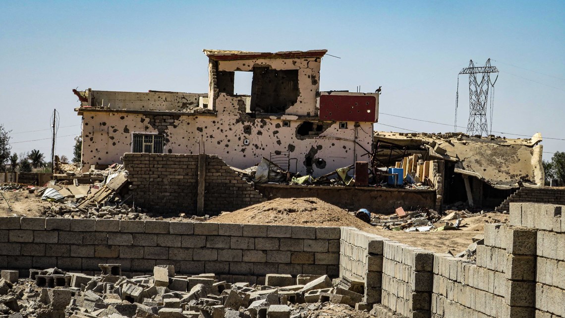 Battle-scarred homes near the minefield