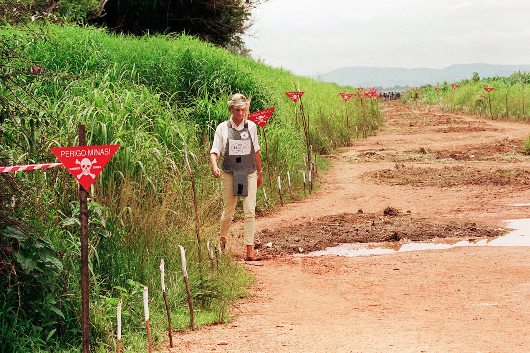 Princess Diana walking through a minefield in Angola in 1997