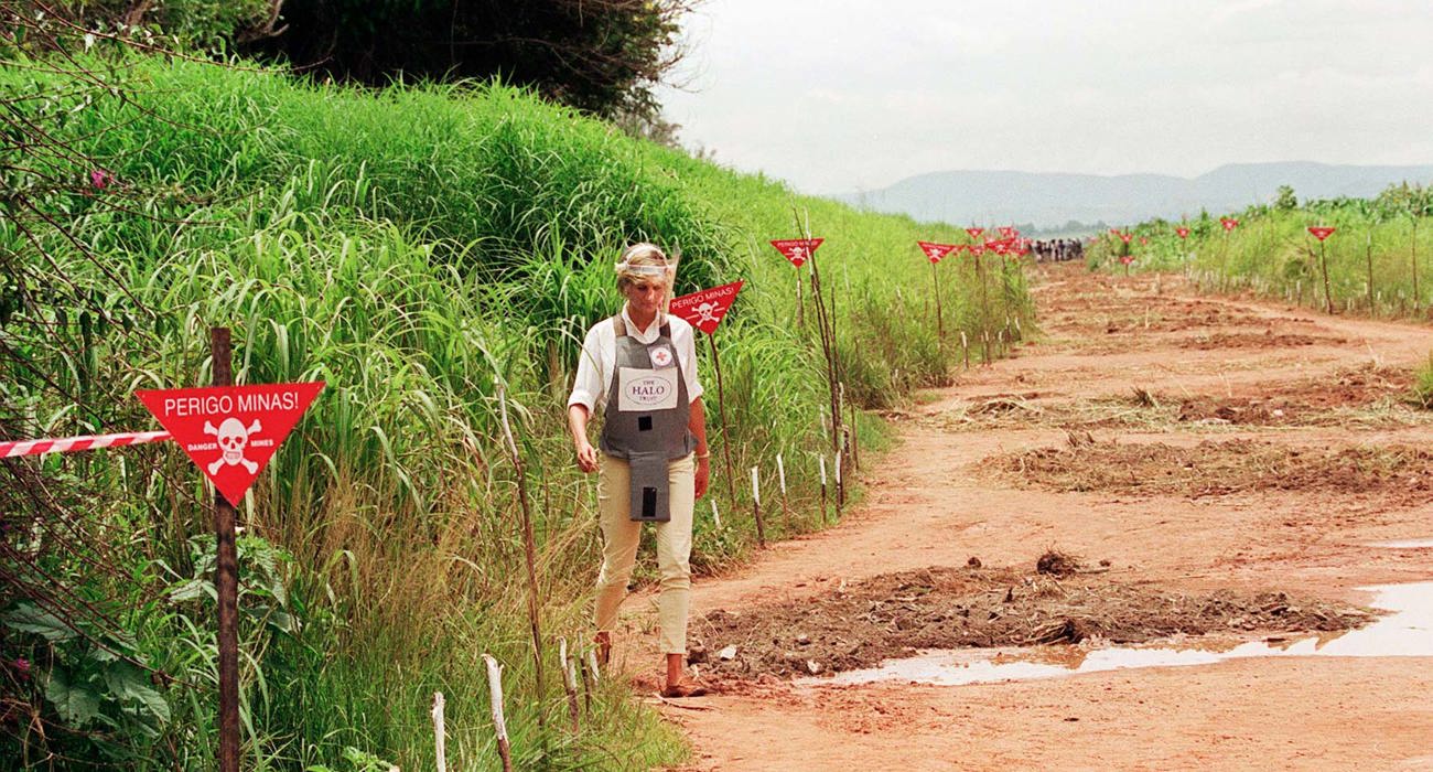 Princess Diana walking through a minefield in Angola in 1997