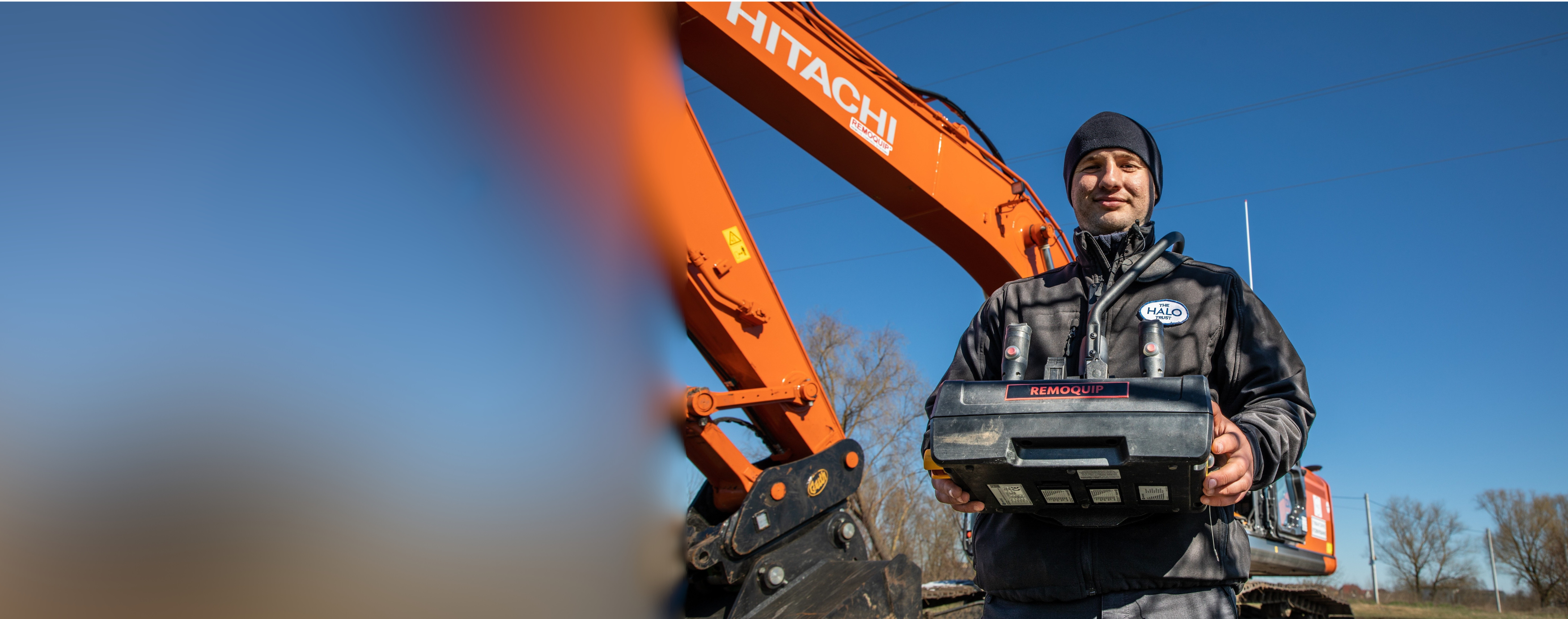 HALO deminer with equipment and a large digger