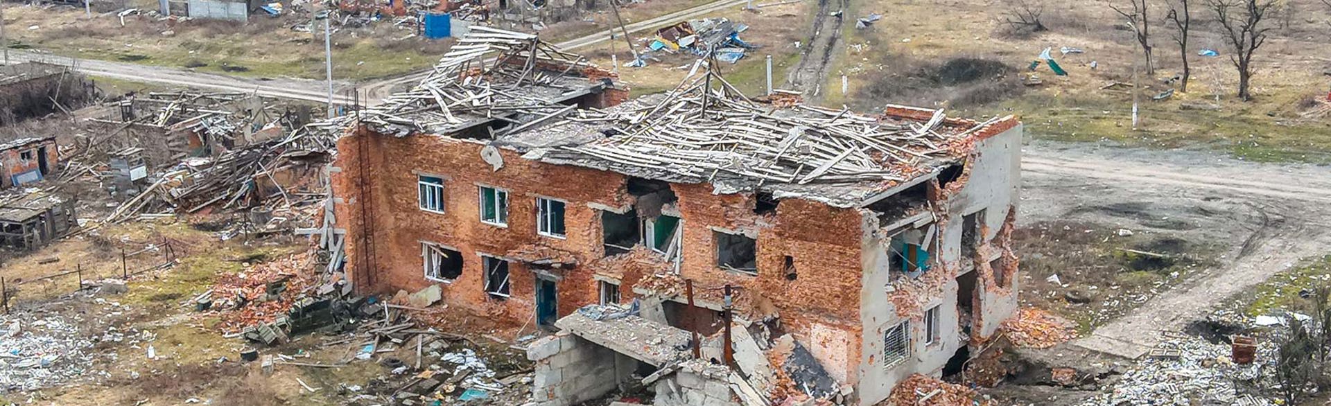A bombed house with crumbling walls and a ruined roof following strikes in Ukraine