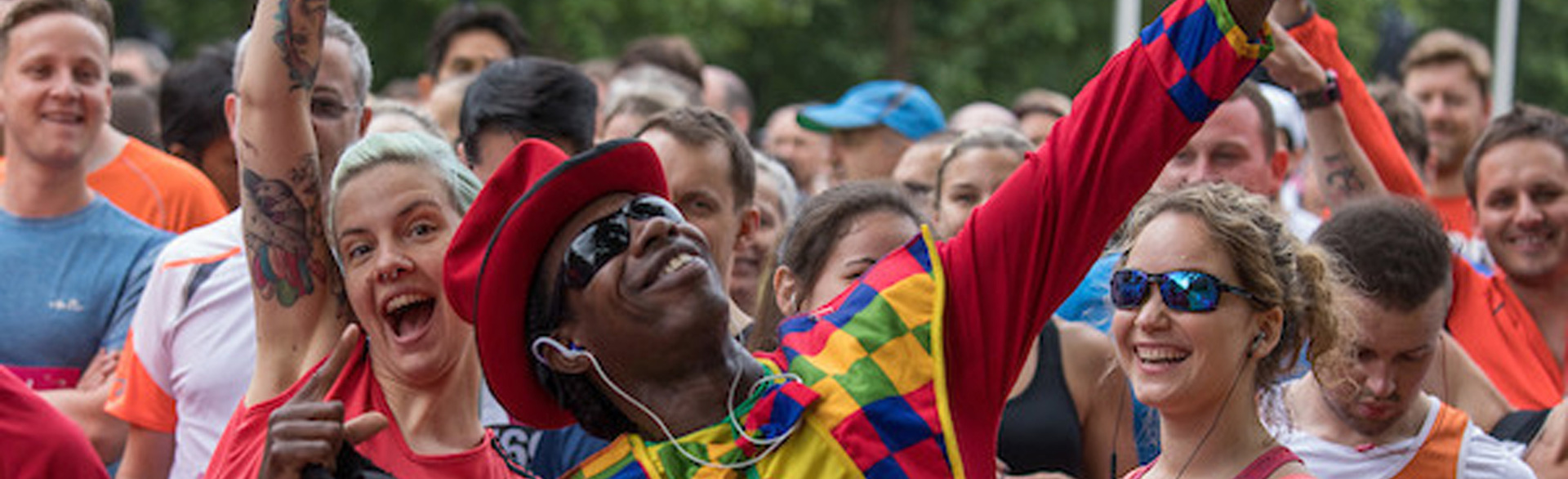 A group of runners smile during the Vitality 10,000 race in London