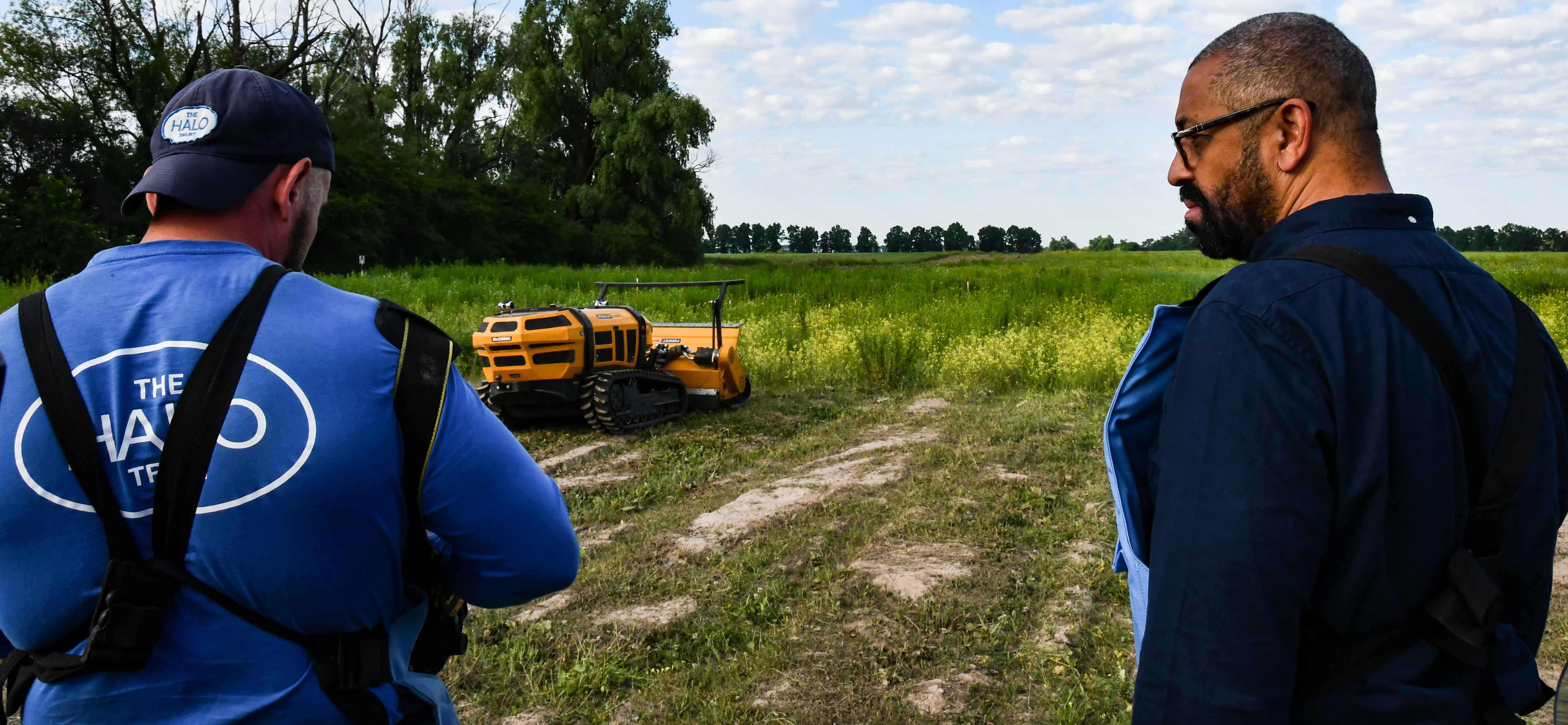 Former Foreign Secretary, James Cleverly, watches a demonstration of a remote controlled vegetation cutter in a minefield in Ukraine