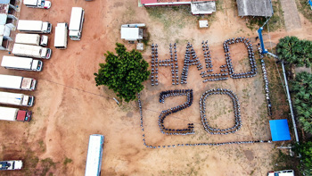HALO Staff stand in formation to display "HALO 20" from a birds-eye view to mark 20 years of HALO in Sri Lanka