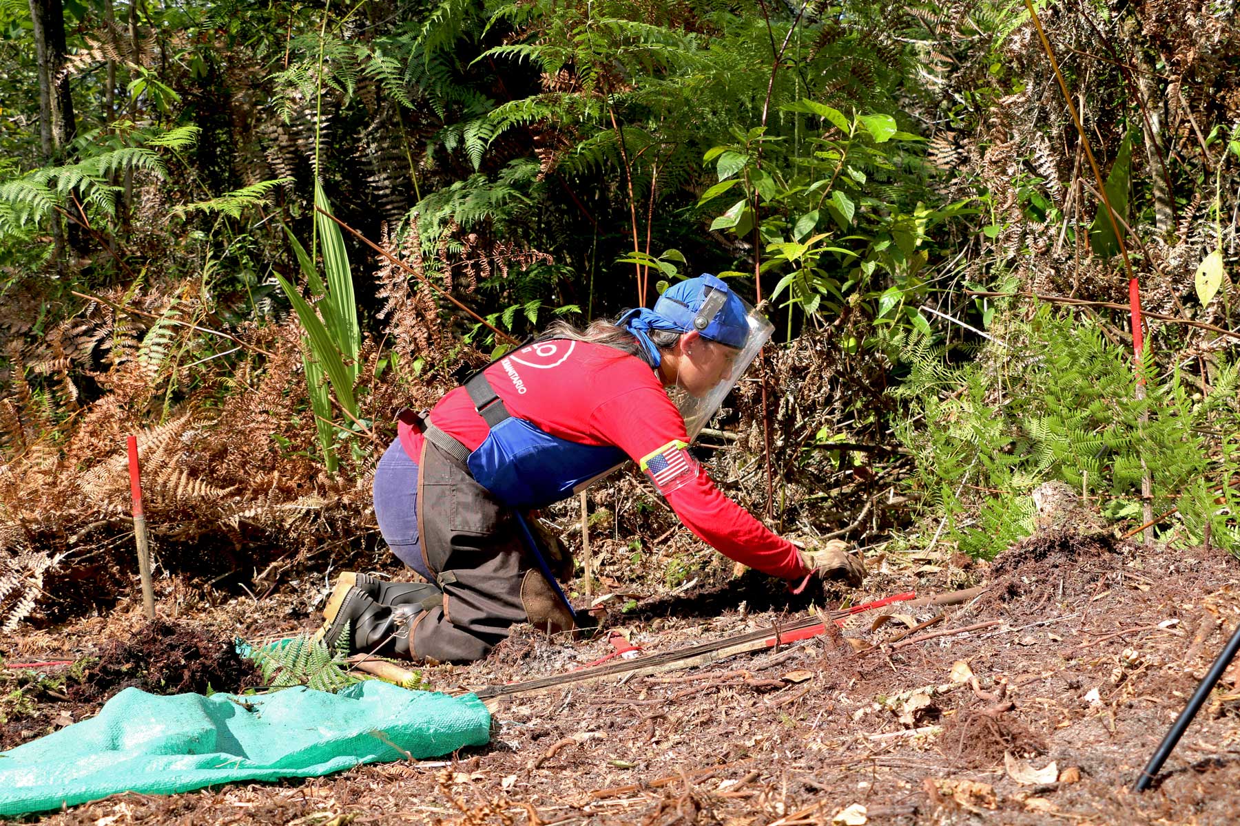 Katerine Ramirez, a HALO staff member carries out demining activities on the ground