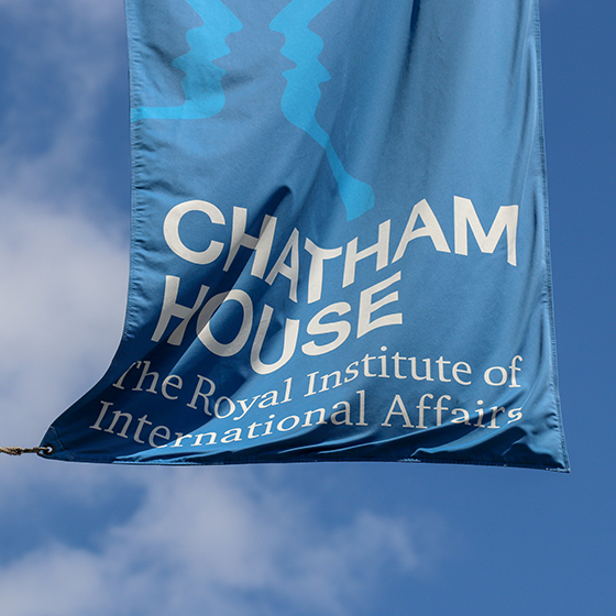 The blue Chatham House flag against a clear blue sky
