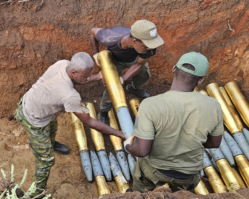HALO deminers handling weapons in Cote d'Ivoire