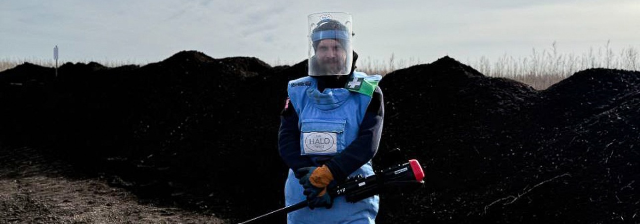 HALO deminer holding a detector