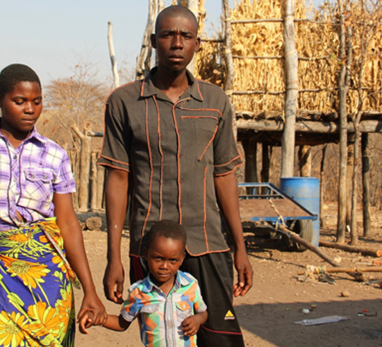 The Chavhunga family stand together in their village in Zimbabwe