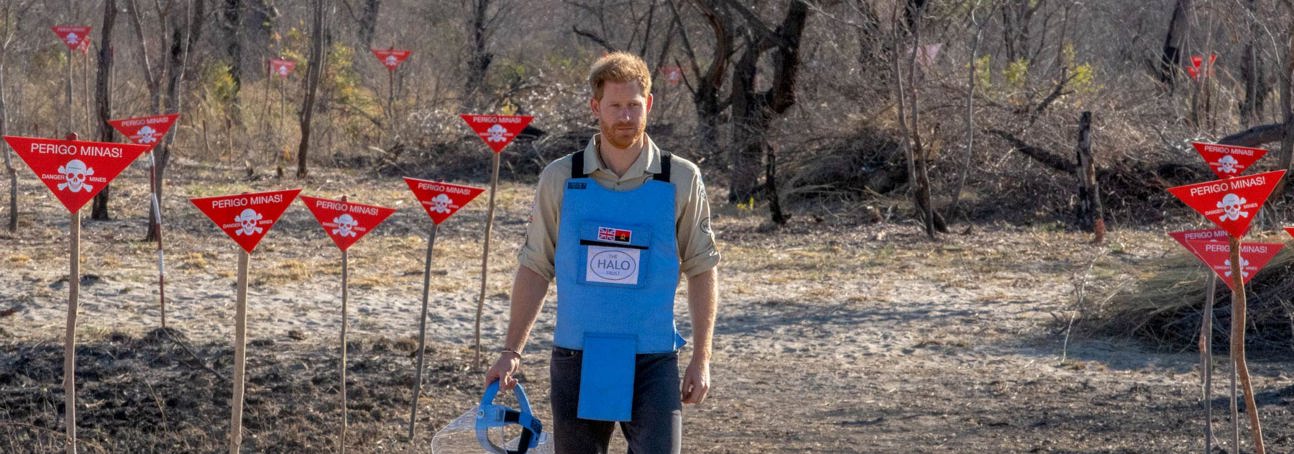 Prince Harry walks through a minefield being cleared by HALO in Dirico, Angola.