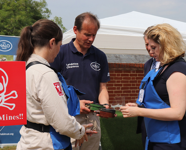HALO CEO, James Cowan, shows Penny Mordaunt various types of mine during a visit to the HALO Office