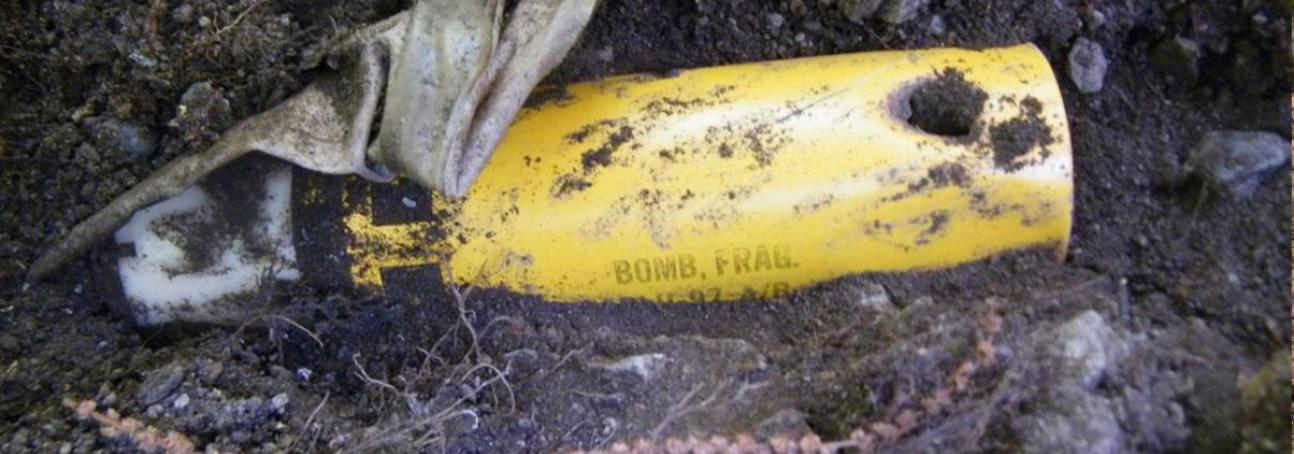 Close up image of a NATO cluster bomb uncovered in the soil in Kosovo