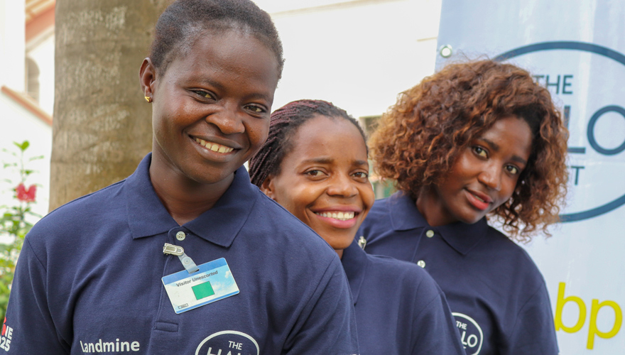 Portrait of three female deminers at the BP Angola grant signing event in Luanda