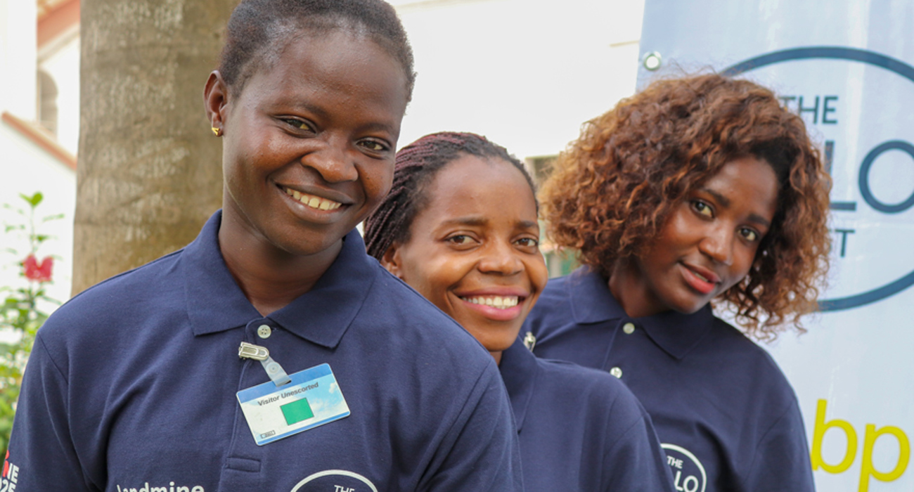 Portrait of three female deminers at the BP Angola grant signing event in Luanda