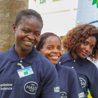Portrait of three female deminers at the BP Angola grant signing event in Luanda