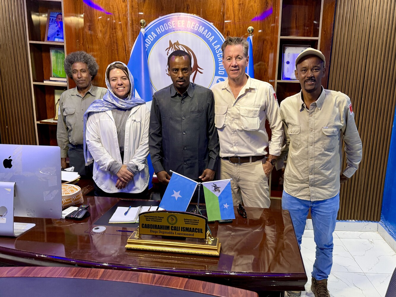 HALO Ambassador Josh Kennedy White stands beside Mayor of Las Anod in a group shot