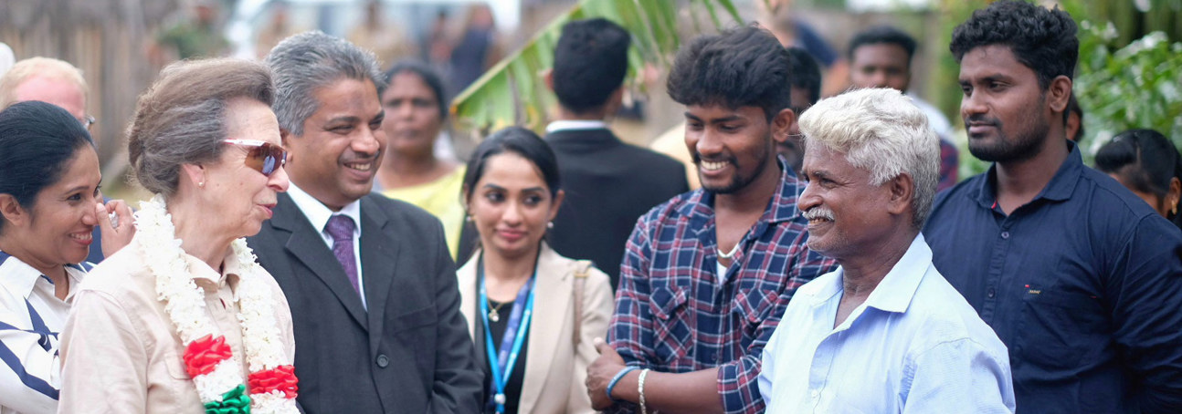 HRH Princess Anne greets HALO Trust staff and delegates whilst wearing a flower garland in Sri Lanka