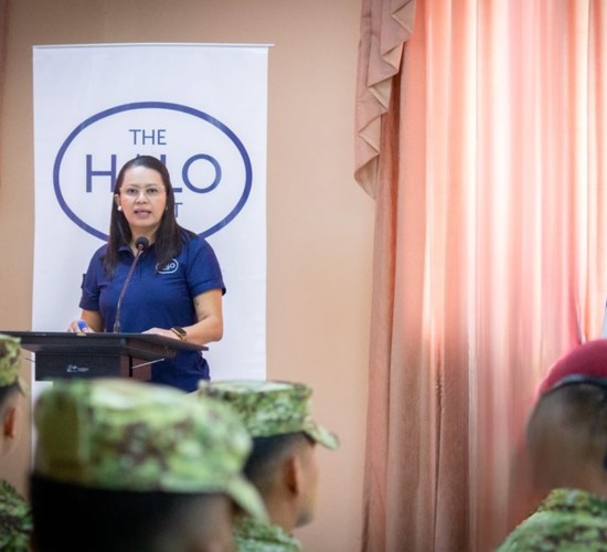 Woman standing at a lectern