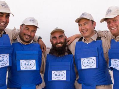 A team of dedicated deminers smile for a group photo following the clearance of districts in Herat Province, Afghanistan