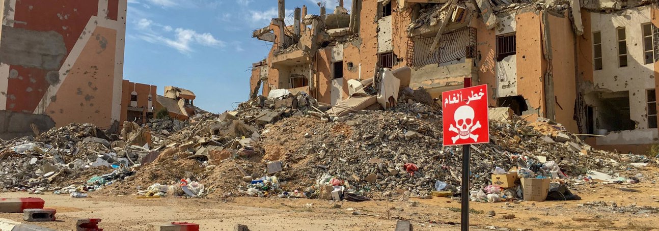 A house contaminated with explosives is marked off in Sirte, Libya