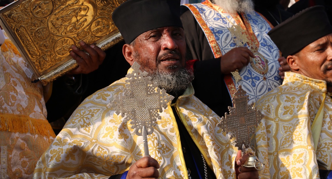 Clergy member during the Epiphany Celebrations at the River Jordan dressed in traditional robes