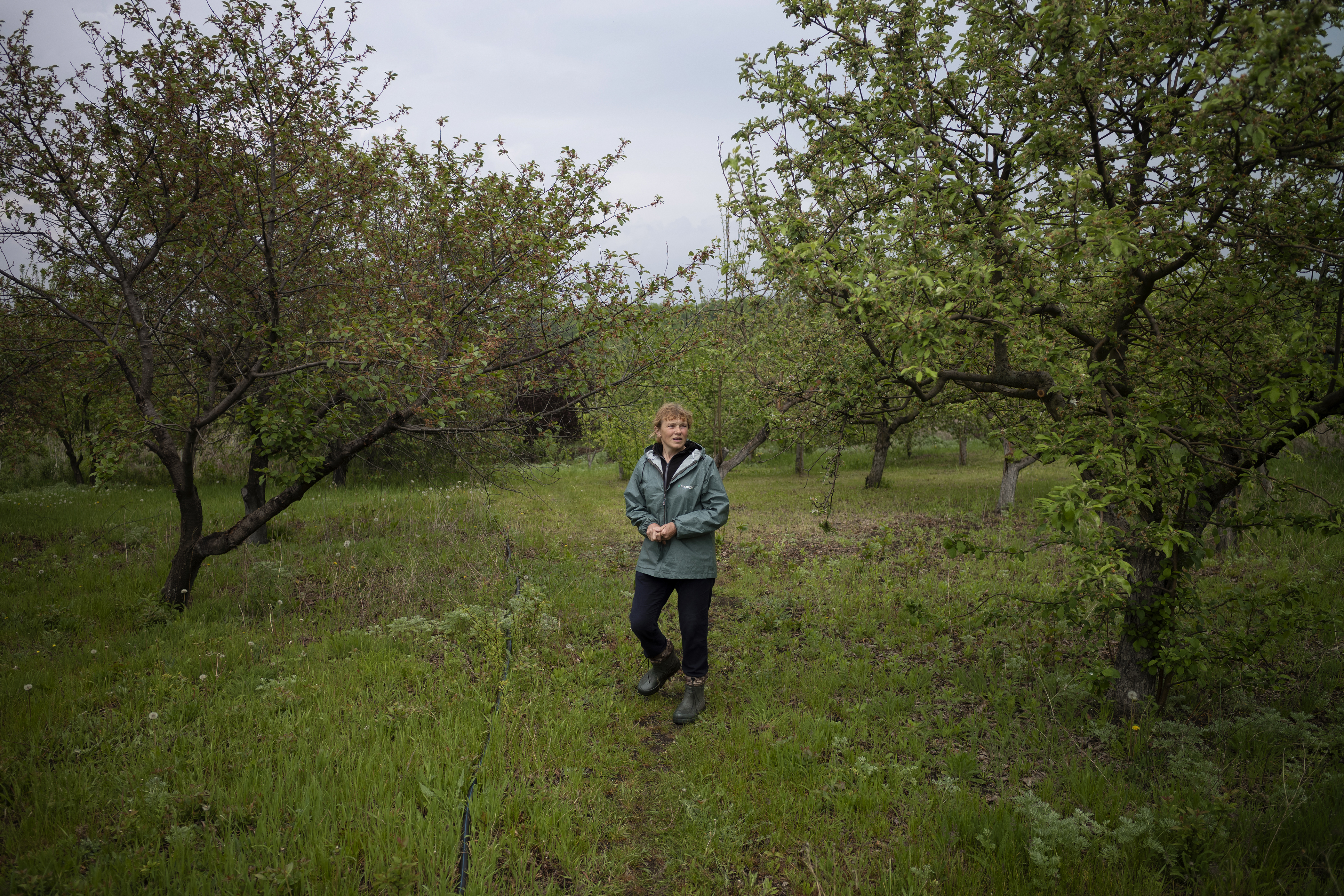 Natalia stands in the middle of her farm land 