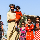 kassim and his children pose outside