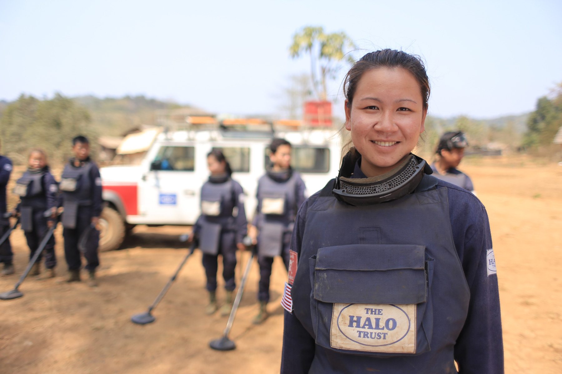 HALO team leader in Cambodia standing on a minefield with the local team
