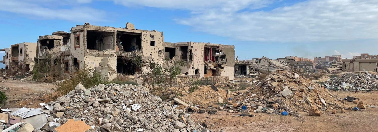 A destroyed building surrounded by rubble in Sirte, Libya
