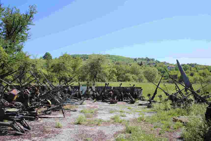 Large collection of rusting weapons in the countryside in Bosnia and Herzegovina