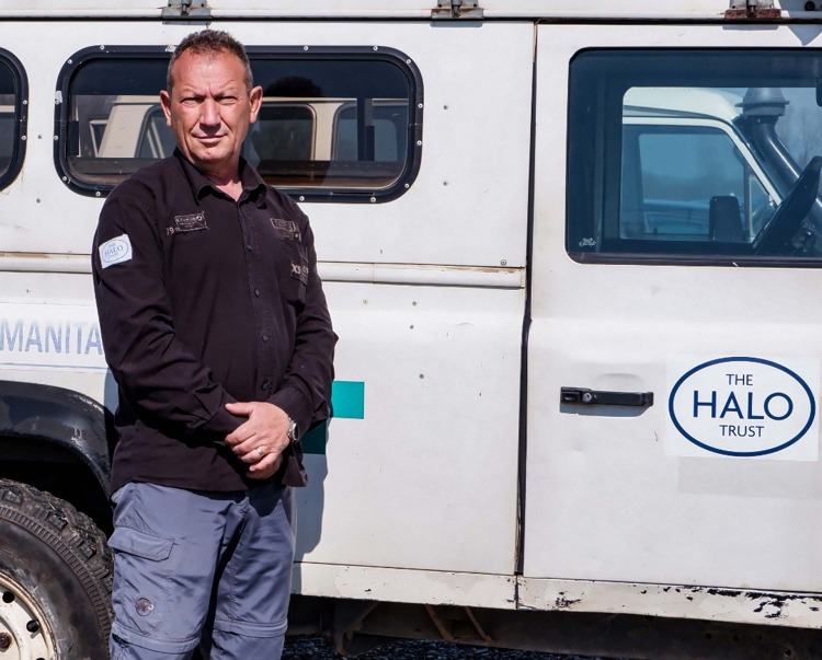 Shkelzen Zeqa, a supervisor in Kosovo, stands in front of a HALO vehicle