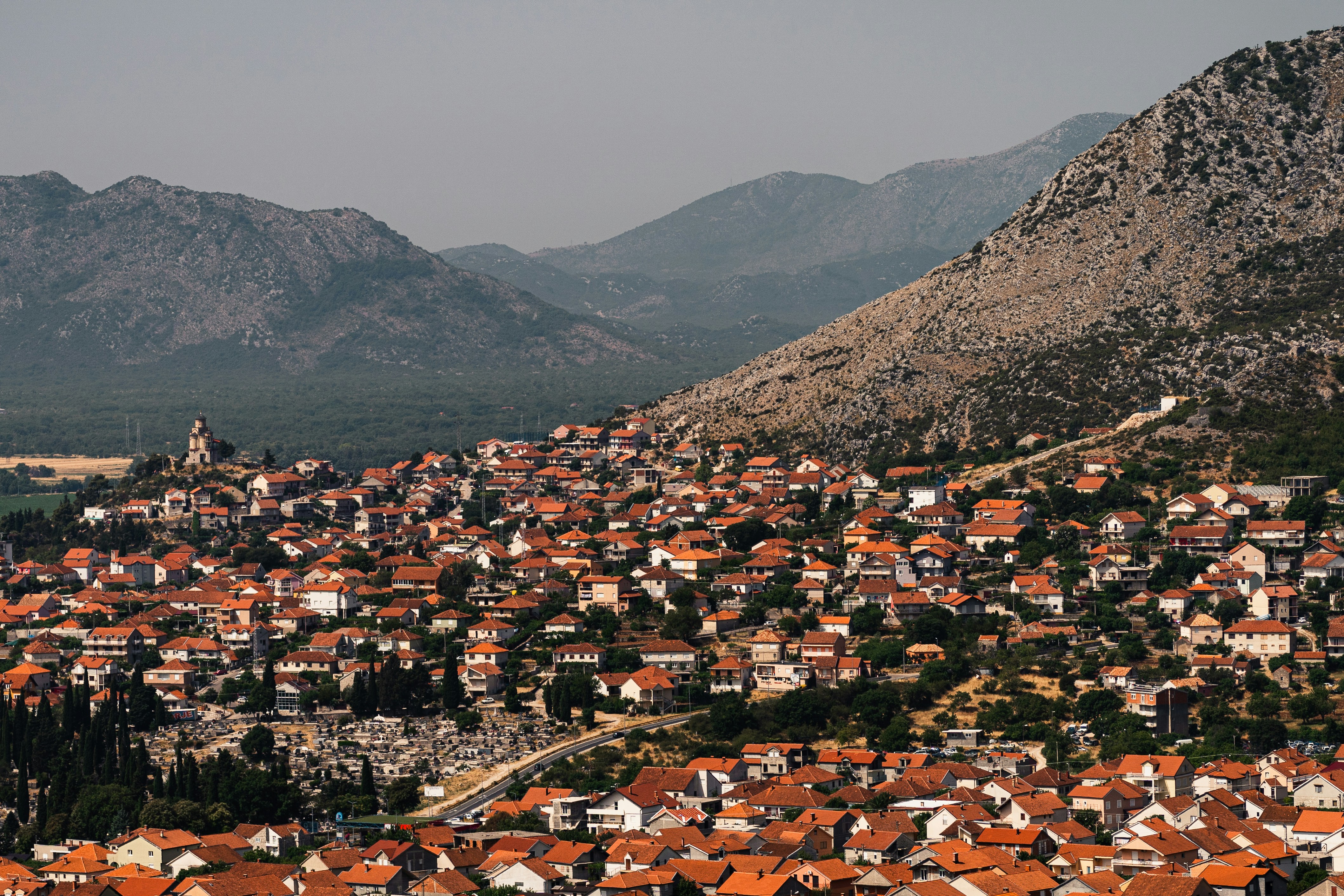 City in Bosnia and Herzegovina with mountains behind