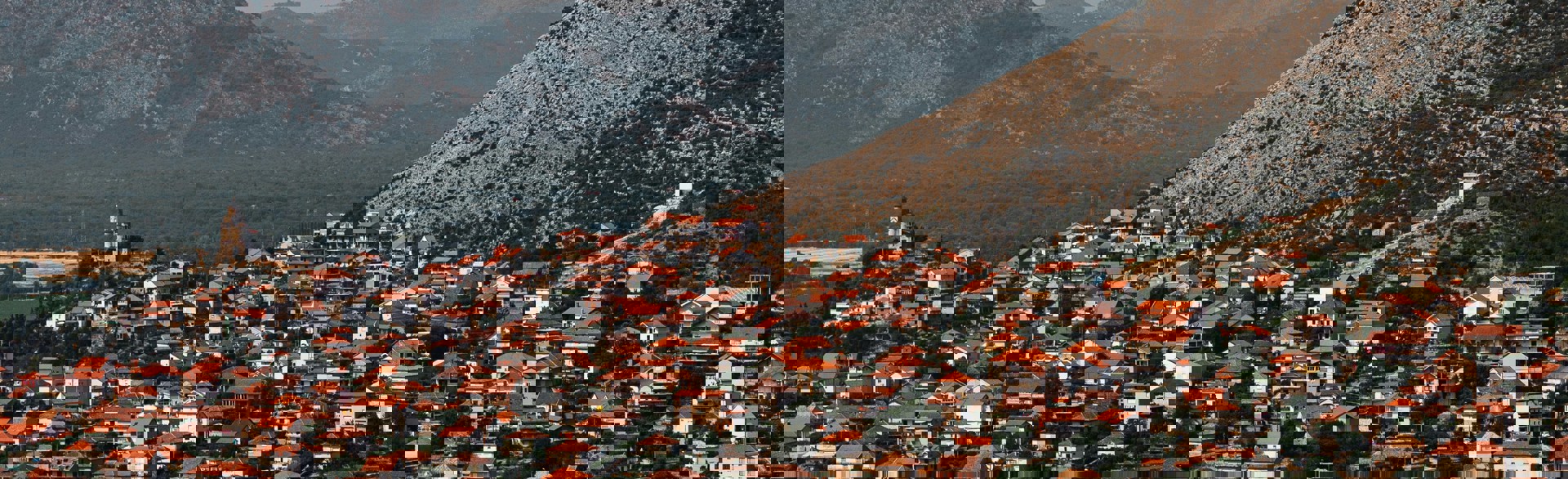 City in Bosnia and Herzegovina with mountains behind