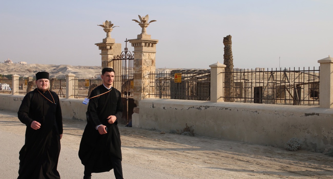 Pilgrims walk through the Baptism Site, formerly contaminated with explosives