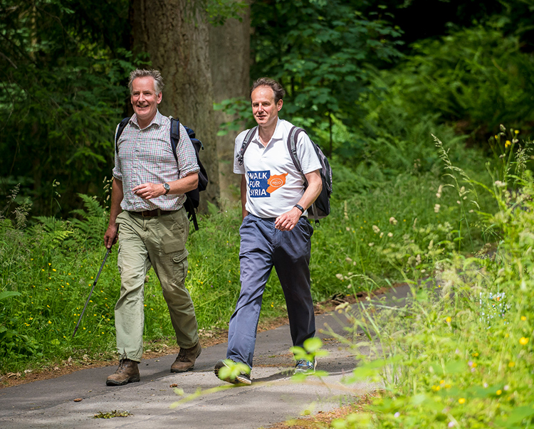 HALO CEO James Cowan and trustee Paddy Beeley, walk for Syria down a country road