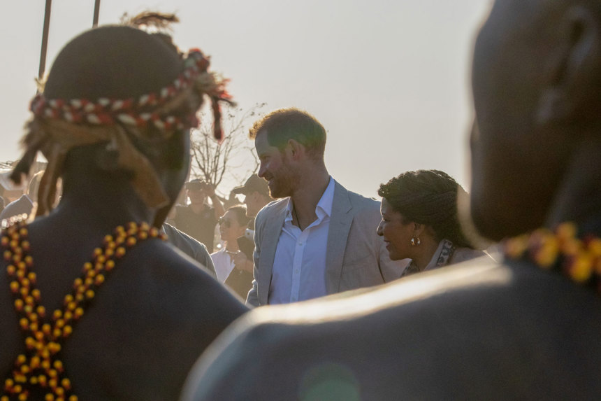 Prince Harry is greeted by local dancers during his visit to a HALO Trust site in Angola